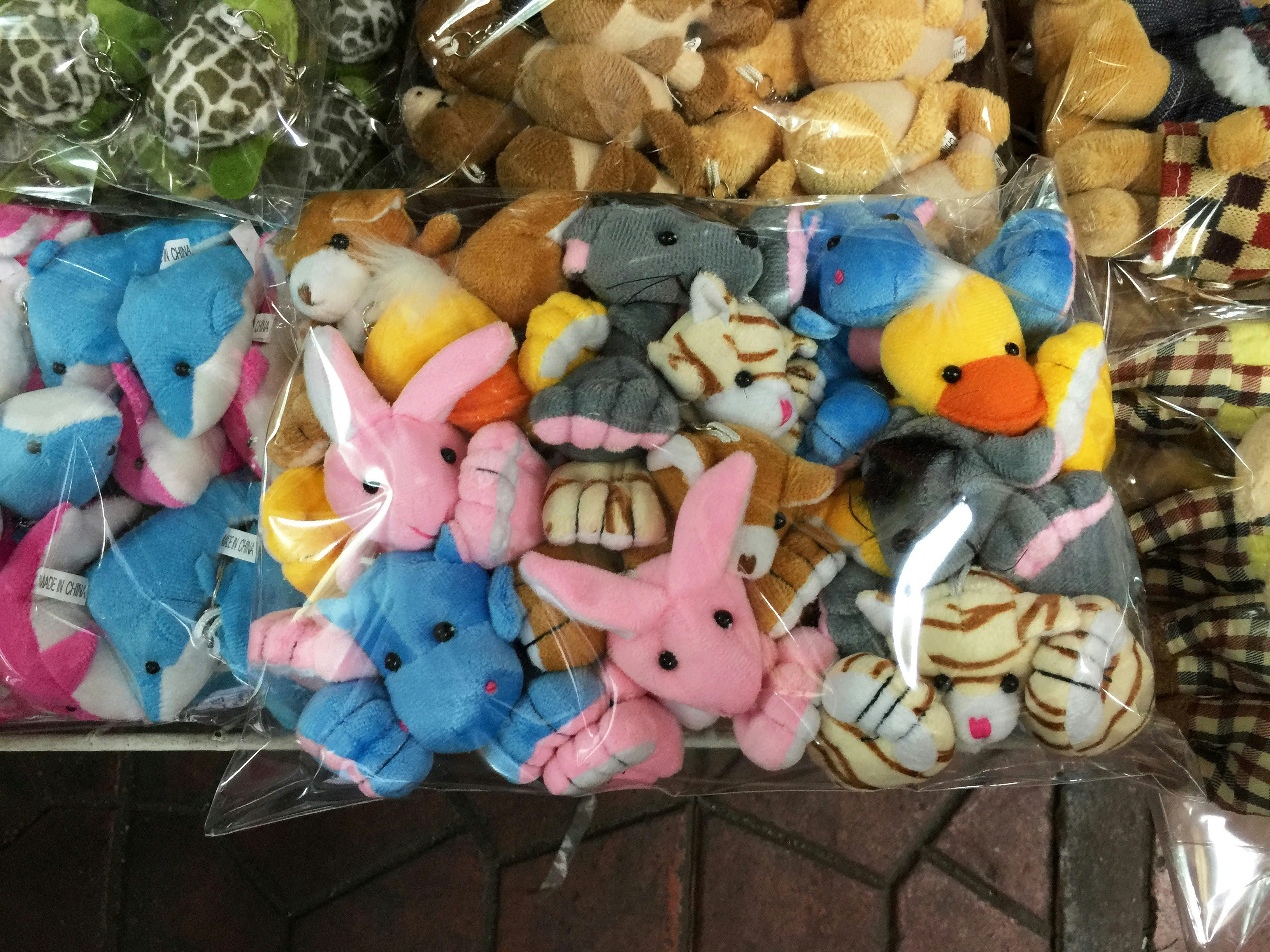 assorted animal plush toys in plastic bag